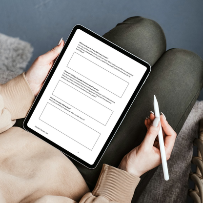 Person holding a tablet filling out the Create Your Virtual Assistant Services Workbook